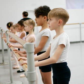 Junior dancers practicing at the barre